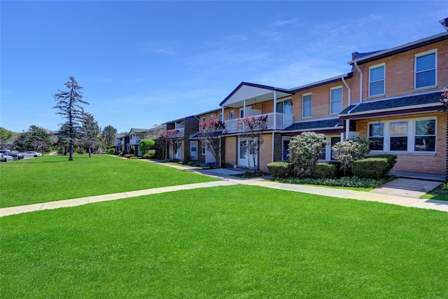 265 Artist Lake Dr, Middle Island, NY 11953 - multi unit property with a residential view, a front lawn, and brick siding