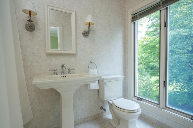 bathroom featuring toilet and tile patterned floors