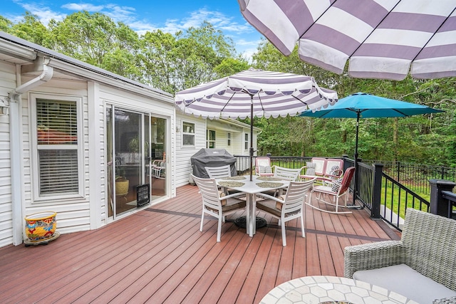 138 Barton Ave, Patchogue, NY 11772 - wooden terrace with outdoor dining area and area for grilling