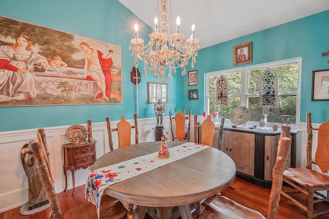 138 Barton Ave, Patchogue, NY 11772 - dining area featuring wood finished floors, a chandelier, and a wainscoted wall