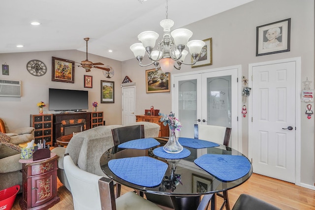 138 Barton Ave, Patchogue, NY 11772 - dining room with wood finished floors, a chandelier, lofted ceiling, french doors, and recessed lighting