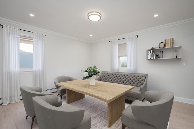 dining space with crown molding, baseboards, recessed lighting, a baseboard radiator, and light wood finished floors