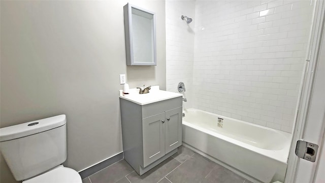 full bathroom featuring tile patterned flooring, vanity, toilet, baseboards, and bathing tub / shower combination