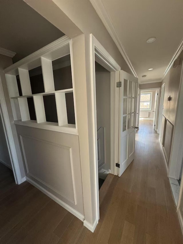 hallway with crown molding, recessed lighting, and wood finished floors