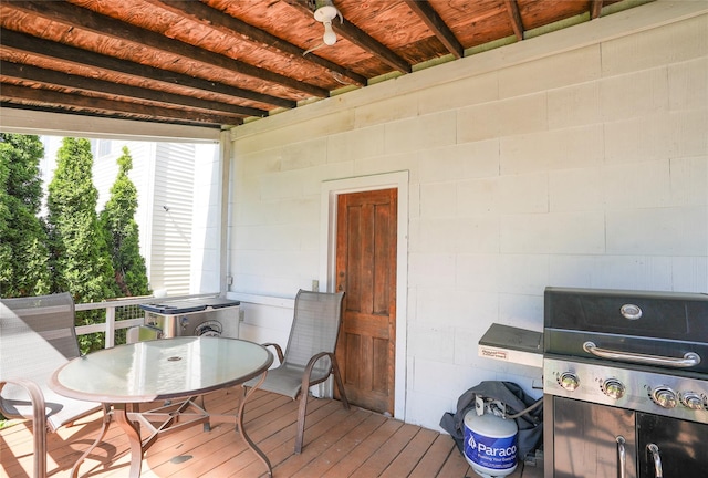 deck with a ceiling fan, outdoor dining area, and a grill