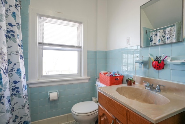 full bathroom with toilet, tile walls, a shower with shower curtain, and vanity