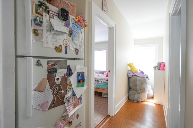 corridor featuring baseboards