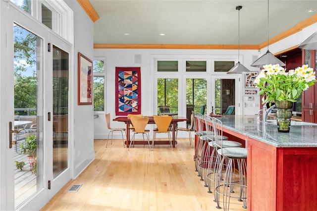 sunroom / solarium featuring french doors and visible vents