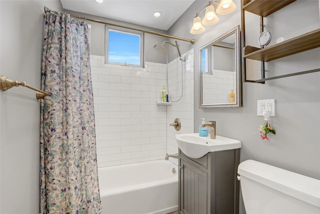 bathroom with vanity, toilet, and shower / tub combo with curtain