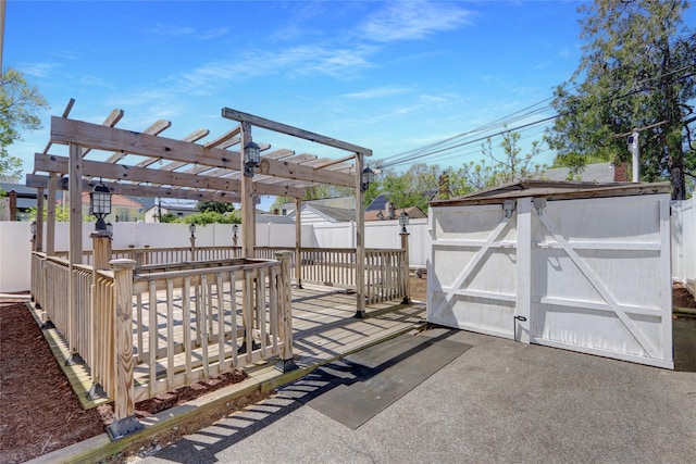 exterior space featuring a fenced backyard and a pergola