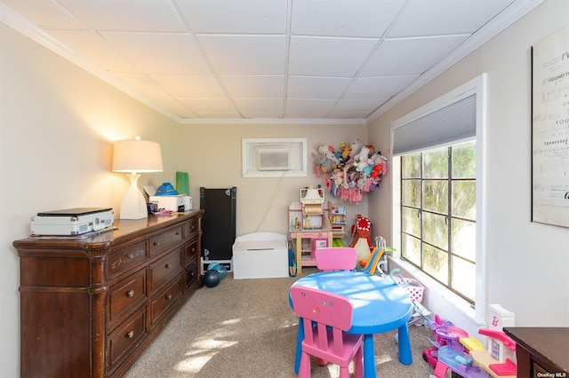 game room featuring ornamental molding, carpet, and a drop ceiling