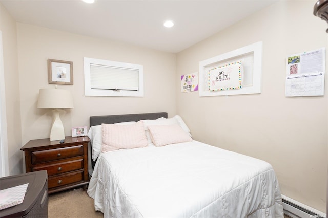 carpeted bedroom with recessed lighting and a baseboard radiator