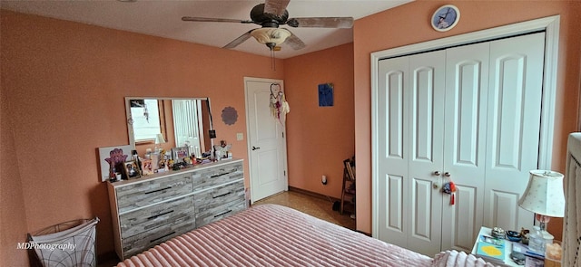 bedroom with a closet, a ceiling fan, and lofted ceiling