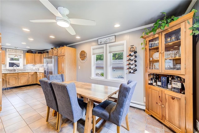 dining area with recessed lighting, a ceiling fan, a baseboard heating unit, and ornamental molding