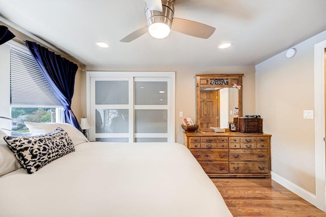 bedroom featuring a ceiling fan, baseboards, recessed lighting, and light wood-type flooring