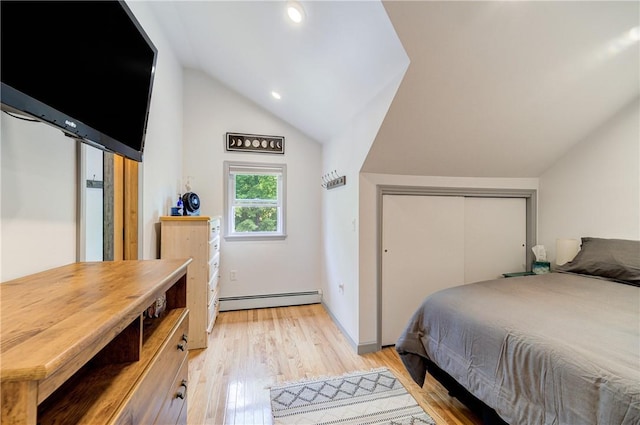 bedroom featuring vaulted ceiling, light wood-type flooring, a baseboard radiator, a closet, and recessed lighting