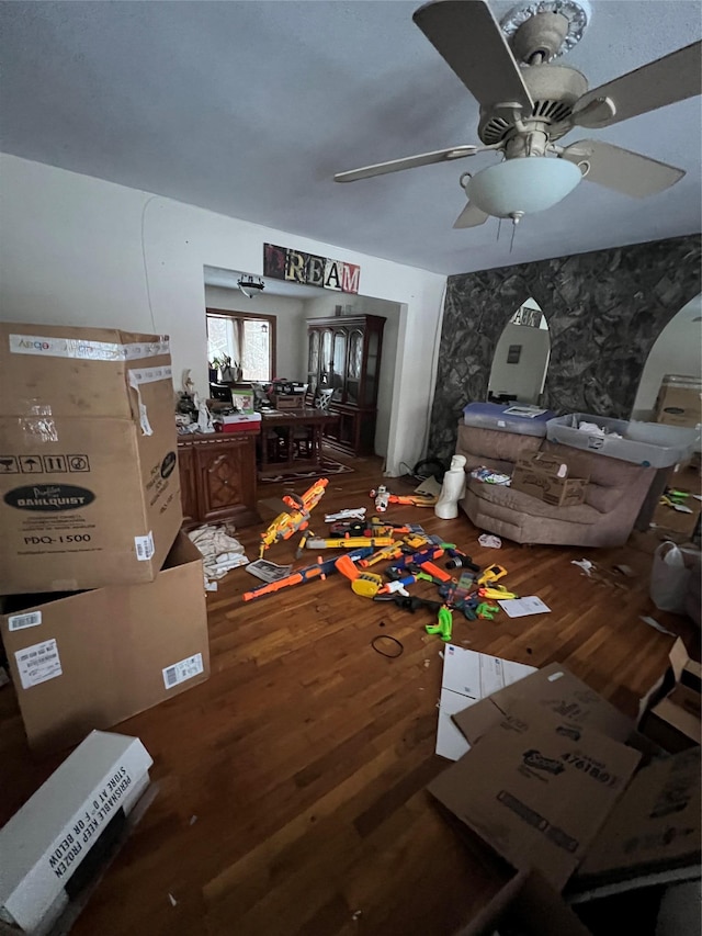 miscellaneous room featuring a ceiling fan and wood finished floors