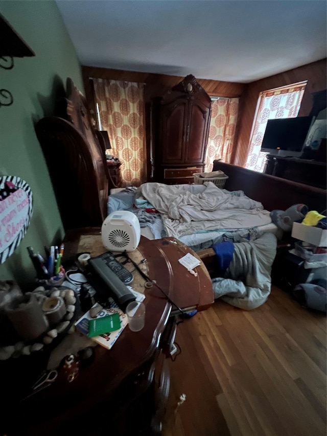 bedroom with wood finished floors
