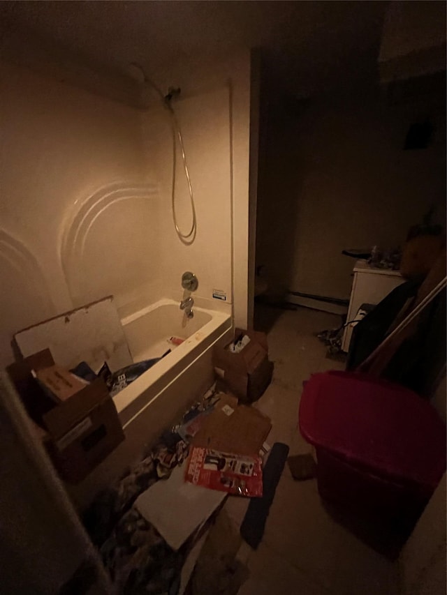 bathroom with washtub / shower combination and toilet