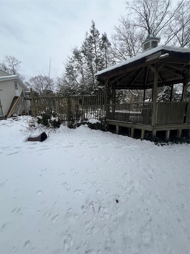 yard covered in snow featuring a gazebo