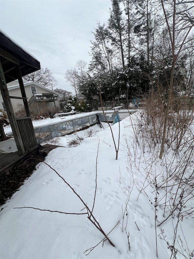 view of yard layered in snow