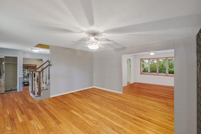 25 Adrienne Ln, Hauppauge, NY 11788 - unfurnished room featuring ceiling fan, stairway, and light wood-type flooring