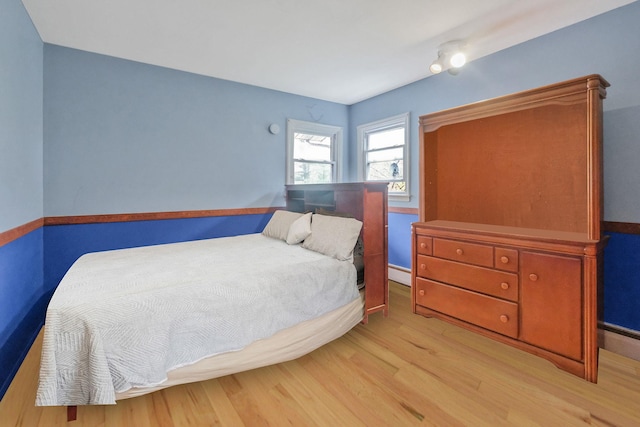 25 Adrienne Ln, Hauppauge, NY 11788 - bedroom with light wood-type flooring and a baseboard heating unit
