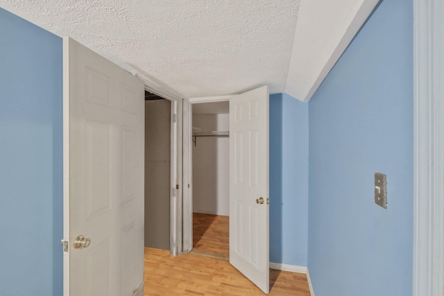 25 Adrienne Ln, Hauppauge, NY 11788 - hall with a textured ceiling and light wood-style flooring