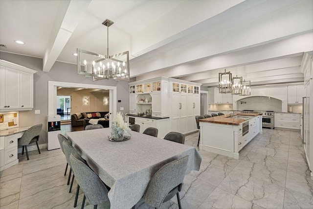 dining room with visible vents, recessed lighting, beam ceiling, and a notable chandelier