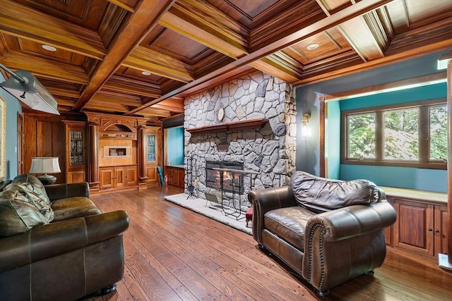 living area featuring wood ceiling, ornamental molding, beamed ceiling, and coffered ceiling