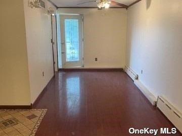 25-54 12th St Unit 3D, Long Island City, NY 11102 - unfurnished room with baseboards, a ceiling fan, a baseboard heating unit, and baseboard heating