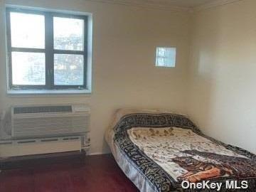25-54 12th St Unit 3D, Long Island City, NY 11102 - bedroom with ornamental molding and a baseboard radiator
