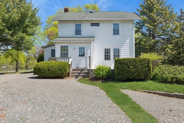 645 Hamilton Ave, Mattituck, NY 11952 - traditional-style home featuring a chimney and a shingled roof