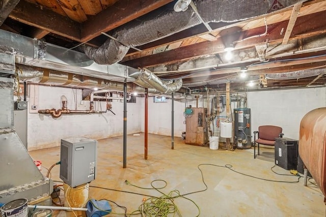 645 Hamilton Ave, Mattituck, NY 11952 - unfinished basement featuring water heater and oil tank