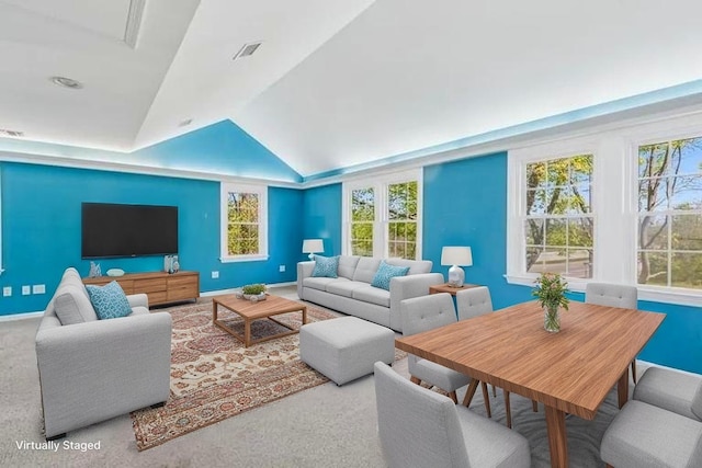 645 Hamilton Ave, Mattituck, NY 11952 - living area with vaulted ceiling, plenty of natural light, and carpet floors