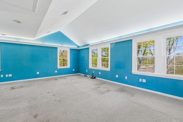645 Hamilton Ave, Mattituck, NY 11952 - carpeted empty room featuring lofted ceiling and baseboards