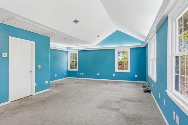 645 Hamilton Ave, Mattituck, NY 11952 - carpeted empty room featuring vaulted ceiling, baseboards, and plenty of natural light
