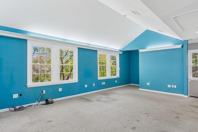 645 Hamilton Ave, Mattituck, NY 11952 - spare room with carpet, lofted ceiling, baseboards, and attic access