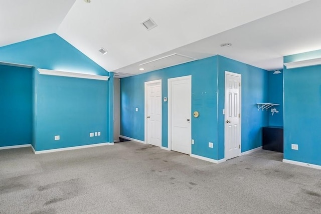 645 Hamilton Ave, Mattituck, NY 11952 - unfurnished bedroom with carpet, lofted ceiling, baseboards, and multiple closets