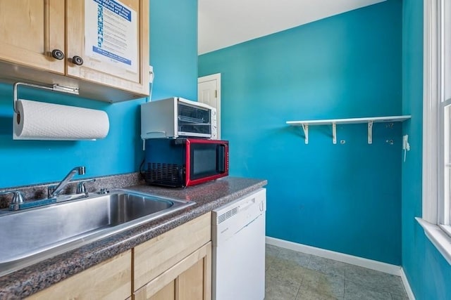 645 Hamilton Ave, Mattituck, NY 11952 - kitchen with dishwasher, black microwave, baseboards, dark countertops, and a sink