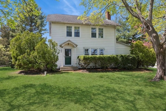 645 Hamilton Ave, Mattituck, NY 11952 - view of front of property with a chimney and a front lawn