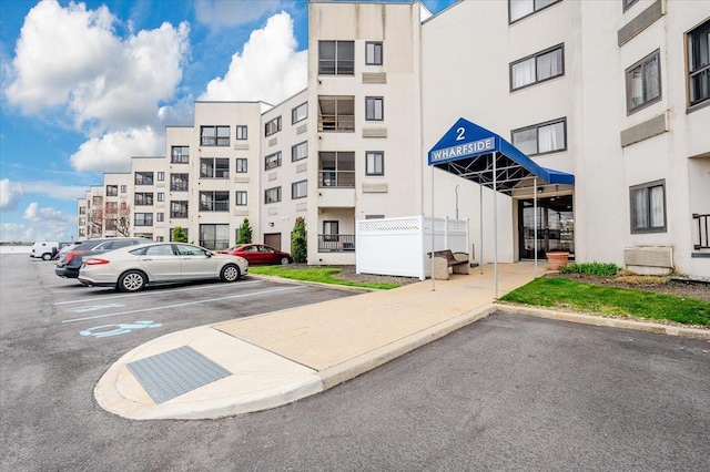 view of property with uncovered parking