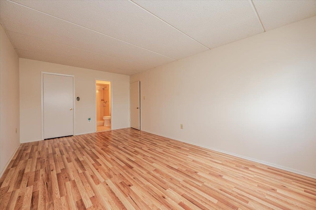 unfurnished room with light wood finished floors