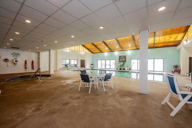 dining room with concrete flooring and recessed lighting