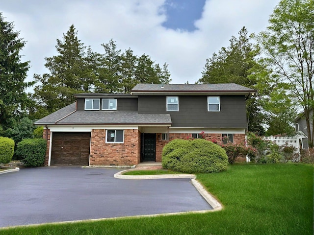 15 Glen Ln, Kings Park, NY 11754 - view of front of property with driveway, brick siding, a front lawn, and a garage