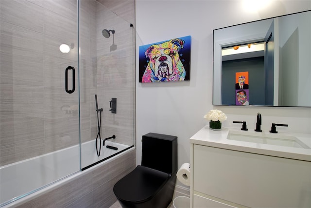 full bath with vanity, toilet, and tiled shower / bath combo
