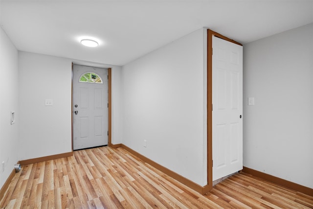 entryway featuring light wood-style floors and baseboards