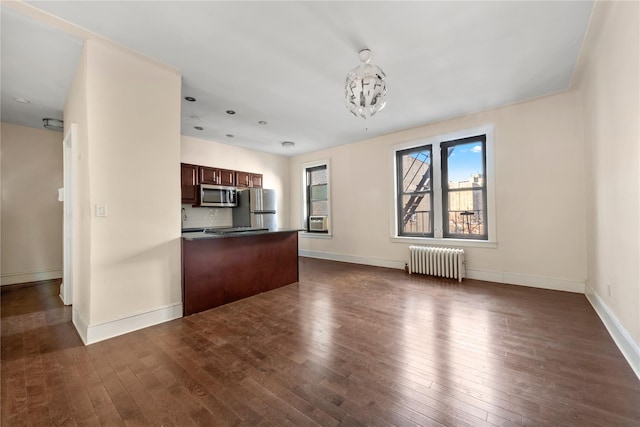 unfurnished living room with radiator heating unit, baseboards, cooling unit, and dark wood-style flooring