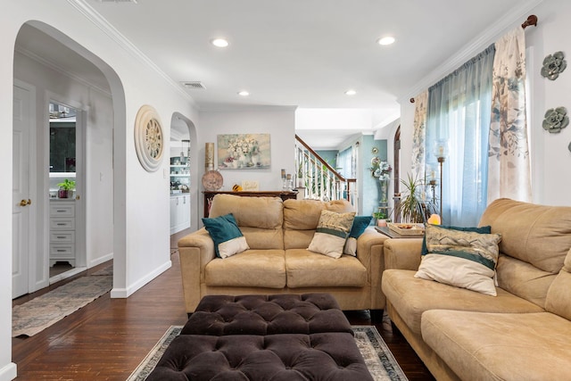 living area featuring arched walkways, stairs, recessed lighting, visible vents, and dark wood-style floors
