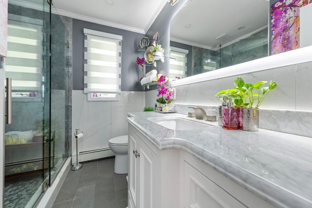 full bathroom featuring crown molding, vanity, toilet, tile walls, and a baseboard radiator